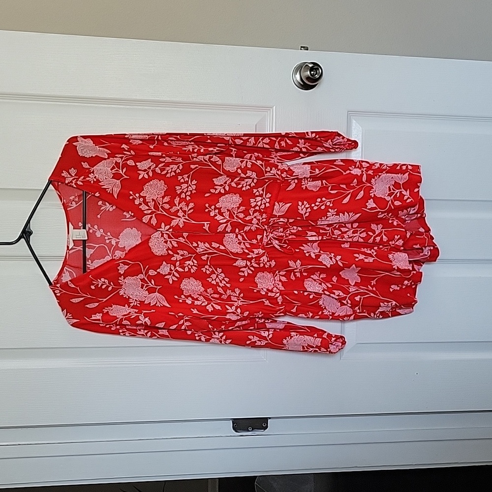 Red short jumpsuit with white flowers